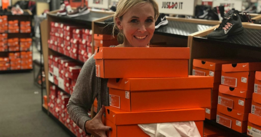 Woman Holding Nike Shoe Boxes