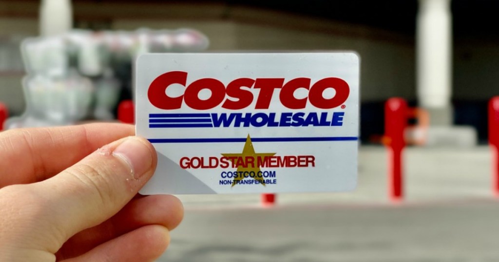 Hand holding a Costco membership card