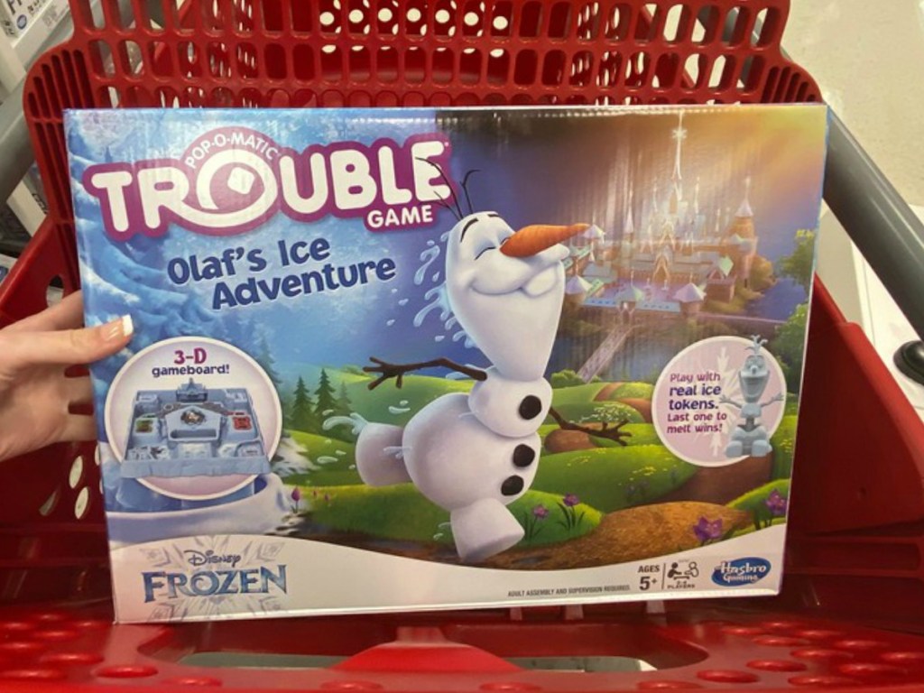 DisneyFrozen Olaf themed Trouble Board Game in seat of red shopping cart at Target