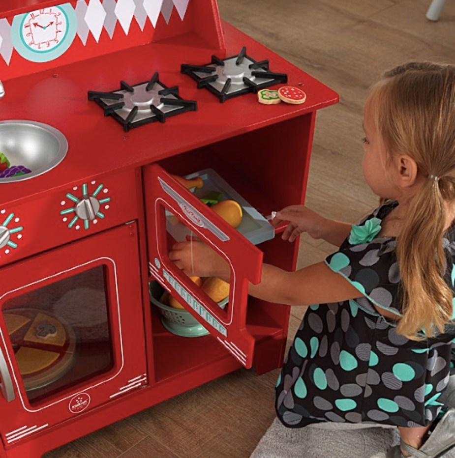 Girl playing with KidKraft Kitchenette