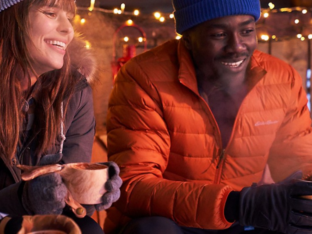 Man wearing orange Eddie Bauer CirrusLite Down Jacket