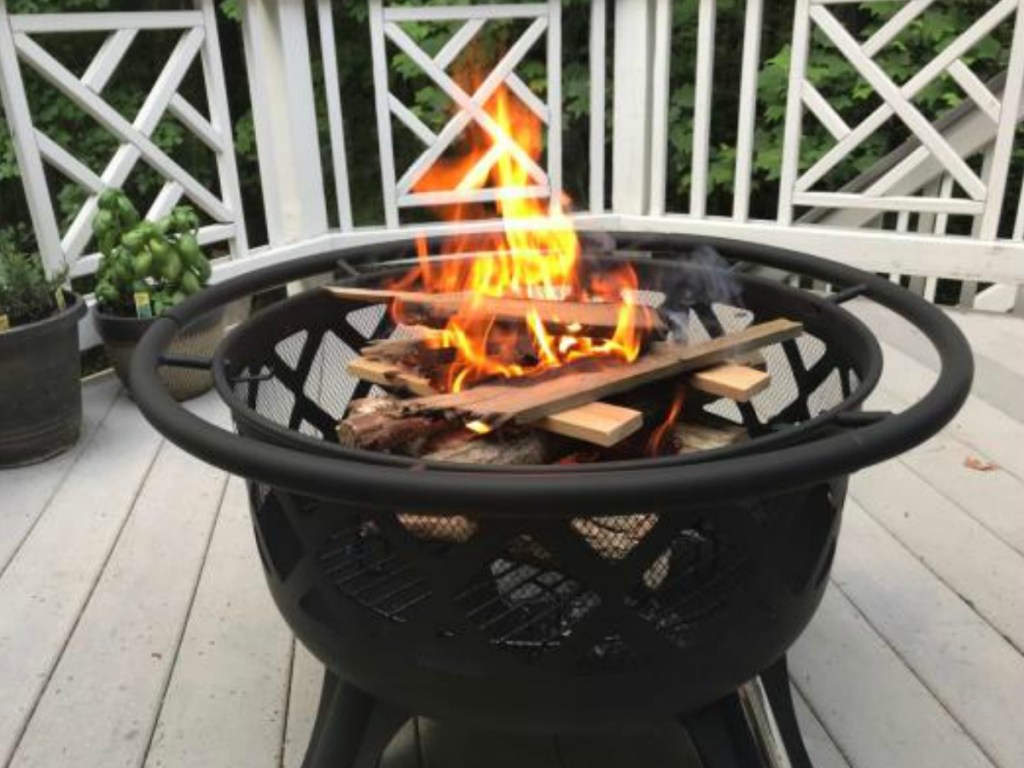 fire burning in fire pit on porch