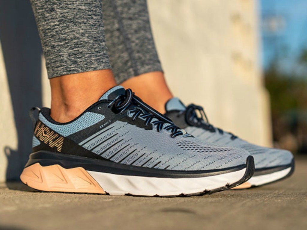 Woman wearing Hoka brand women's running shoes