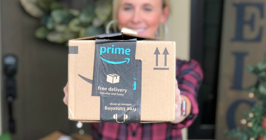 woman holding out Amazon Prime Box