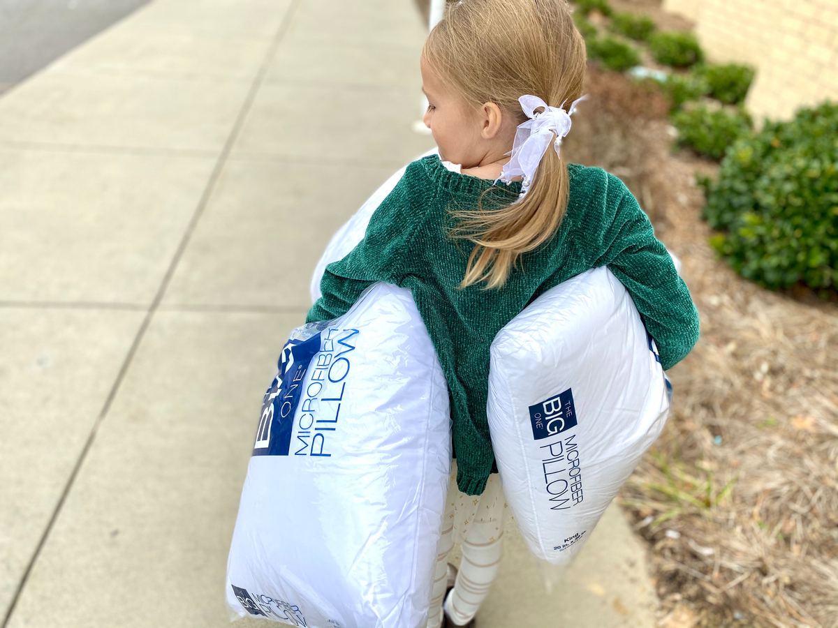 Girl Holding The Big One Pillows