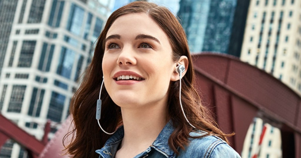 Young woman wearing JBL Earbuds