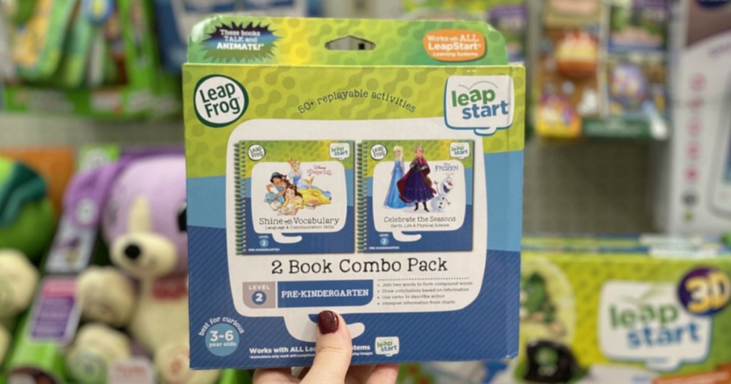 hand holding LeapFrog LeapStart books