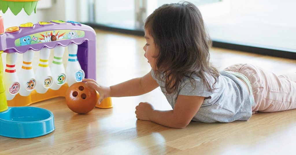 toddler girl bowling with Little Tikes 3-in-1 Sports Zone