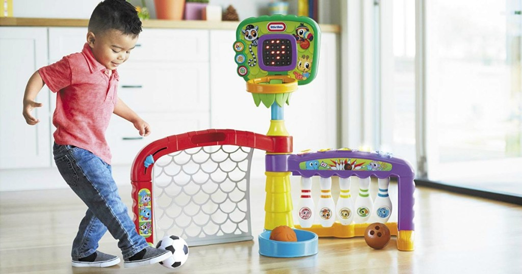 toddler boy playing with Little Tikes 3-in-1 Sports Zone