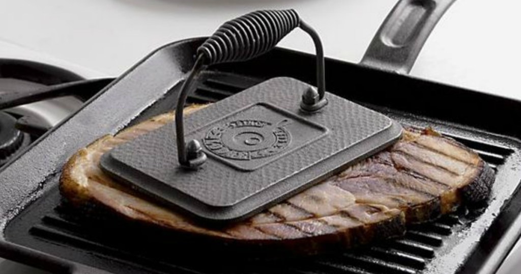 Lodge Rectangular Cast Iron Grill Press on steak