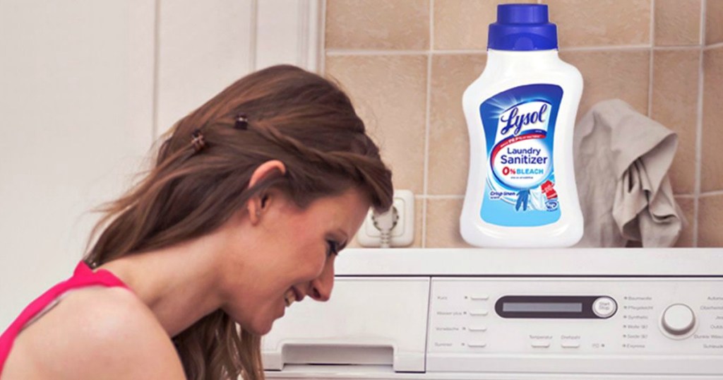 woman using lyson laundry sanitizer