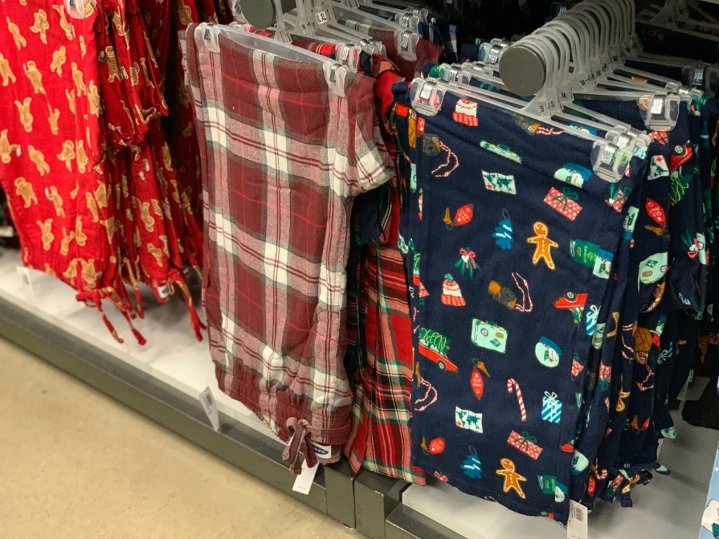 Styles of men's pajamas pants on hangers at Old Navy store