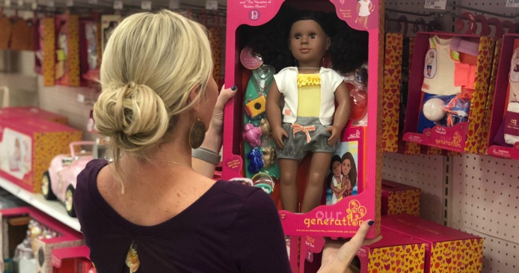 Woman in Target holding an Our Generation Doll in package