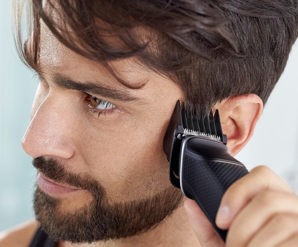 man using hair trimmer