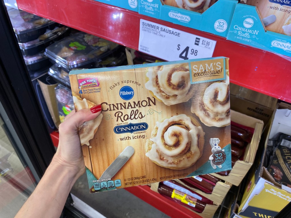 hand holding Pillsbury Cinnamon Rolls