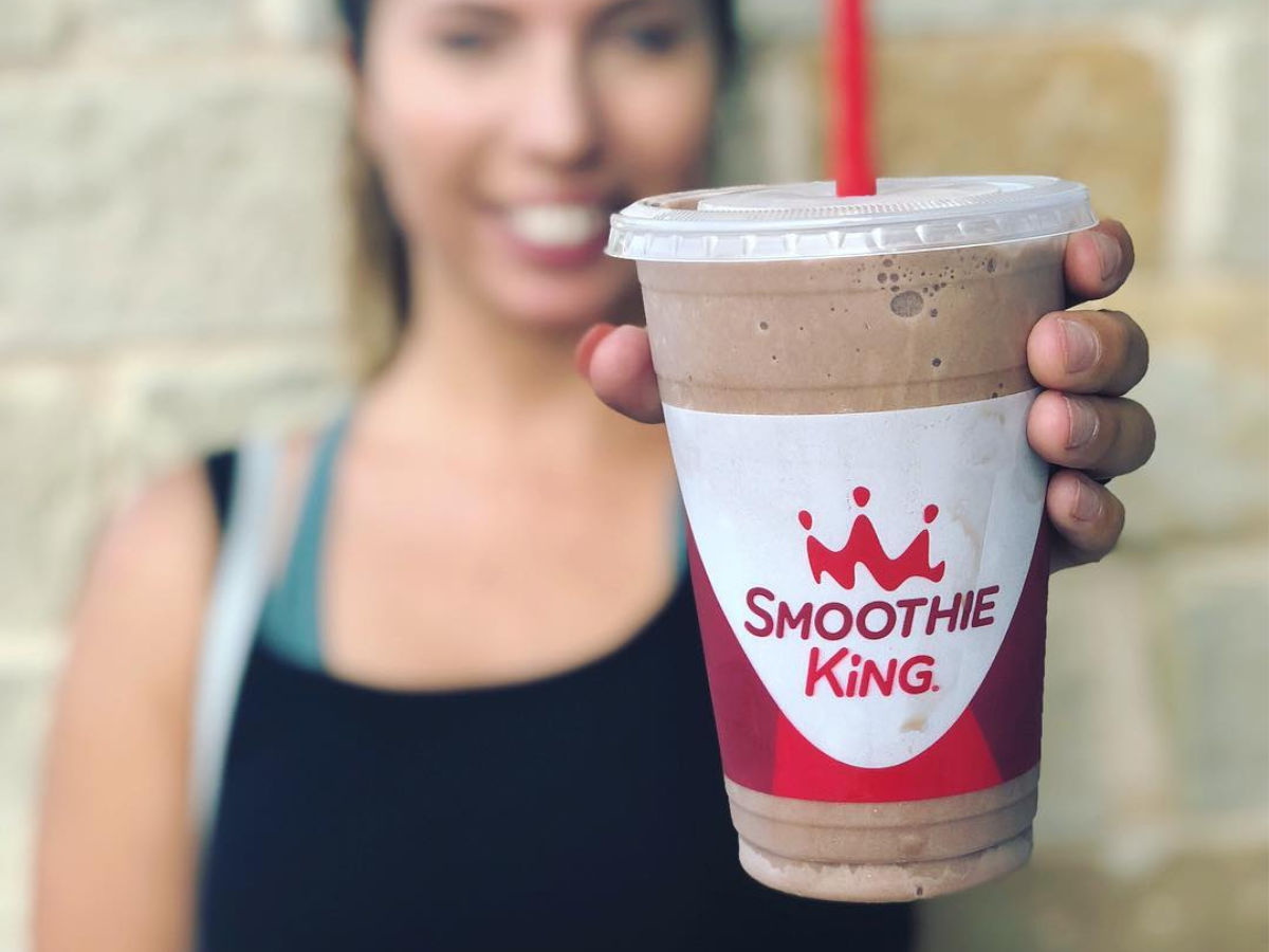 woman holding Smoothie King Chocolate Smoothie