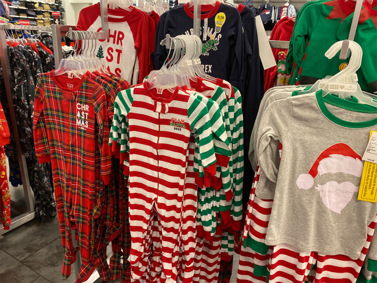The Children's Place christmas pajamas hanging on racks