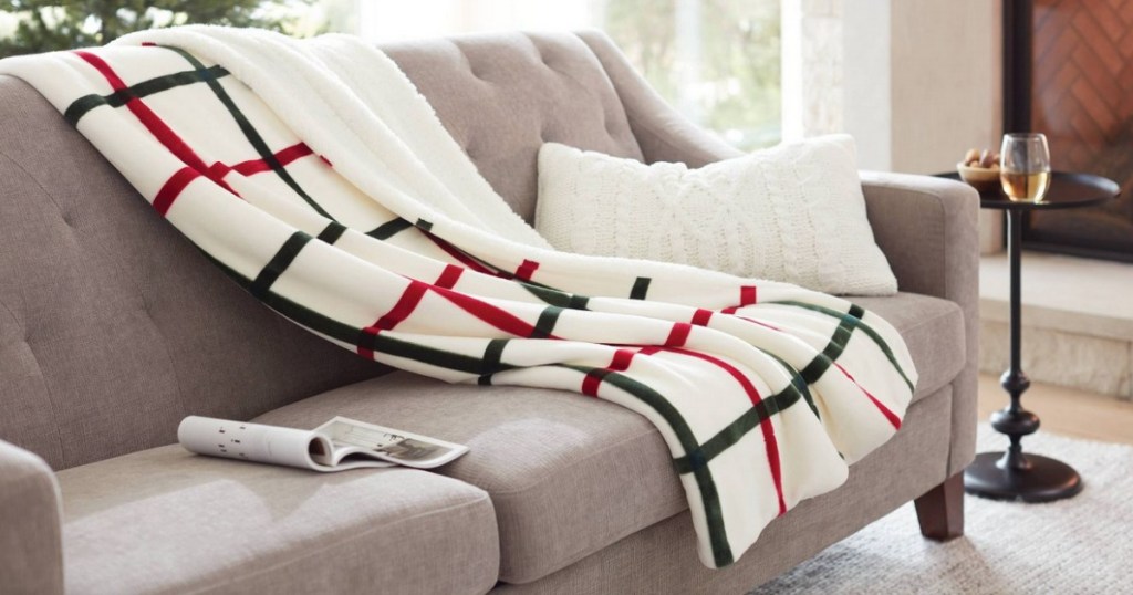 Holiday Sherpa Blanket draped on couch