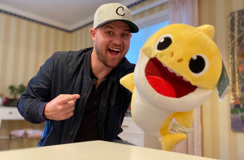 stetson with a yellow baby shark puppet toy 