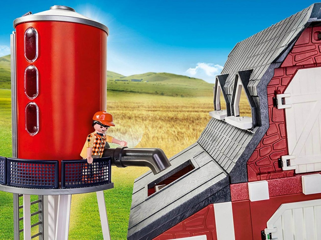 little play toy on silo with barn