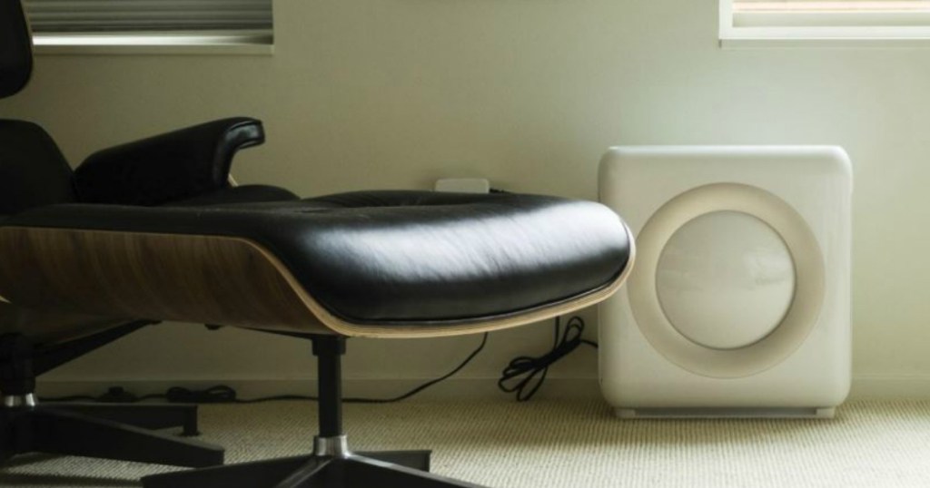 white air purifier next to office chair