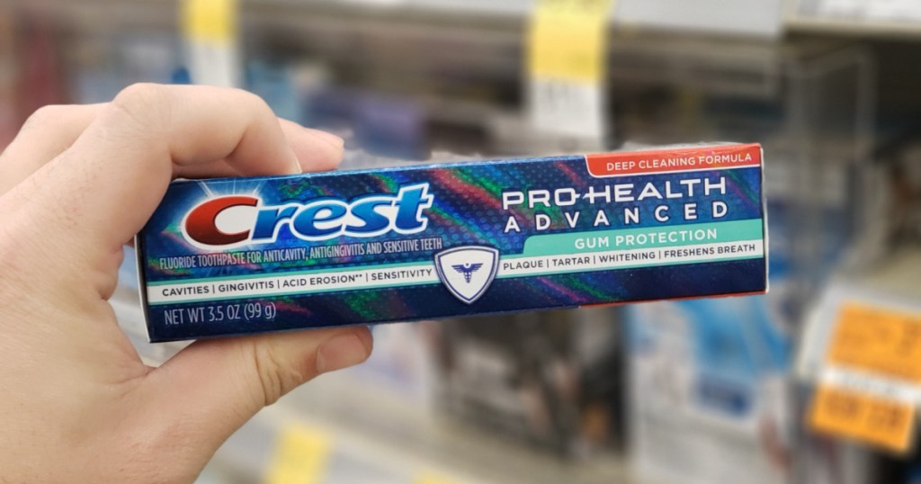 hand holding up box of crest pro health toothpaste