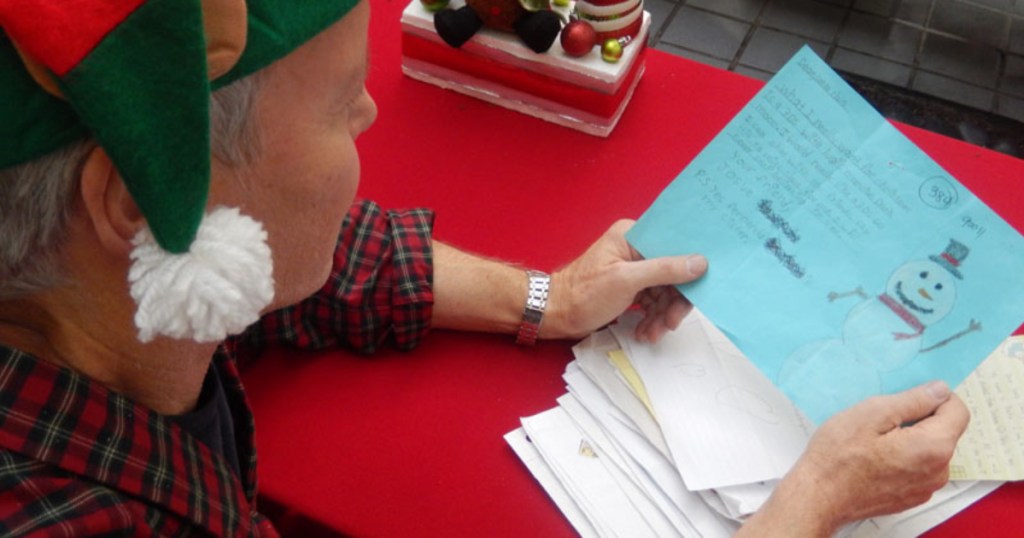 elf reading letter for Operation Santa