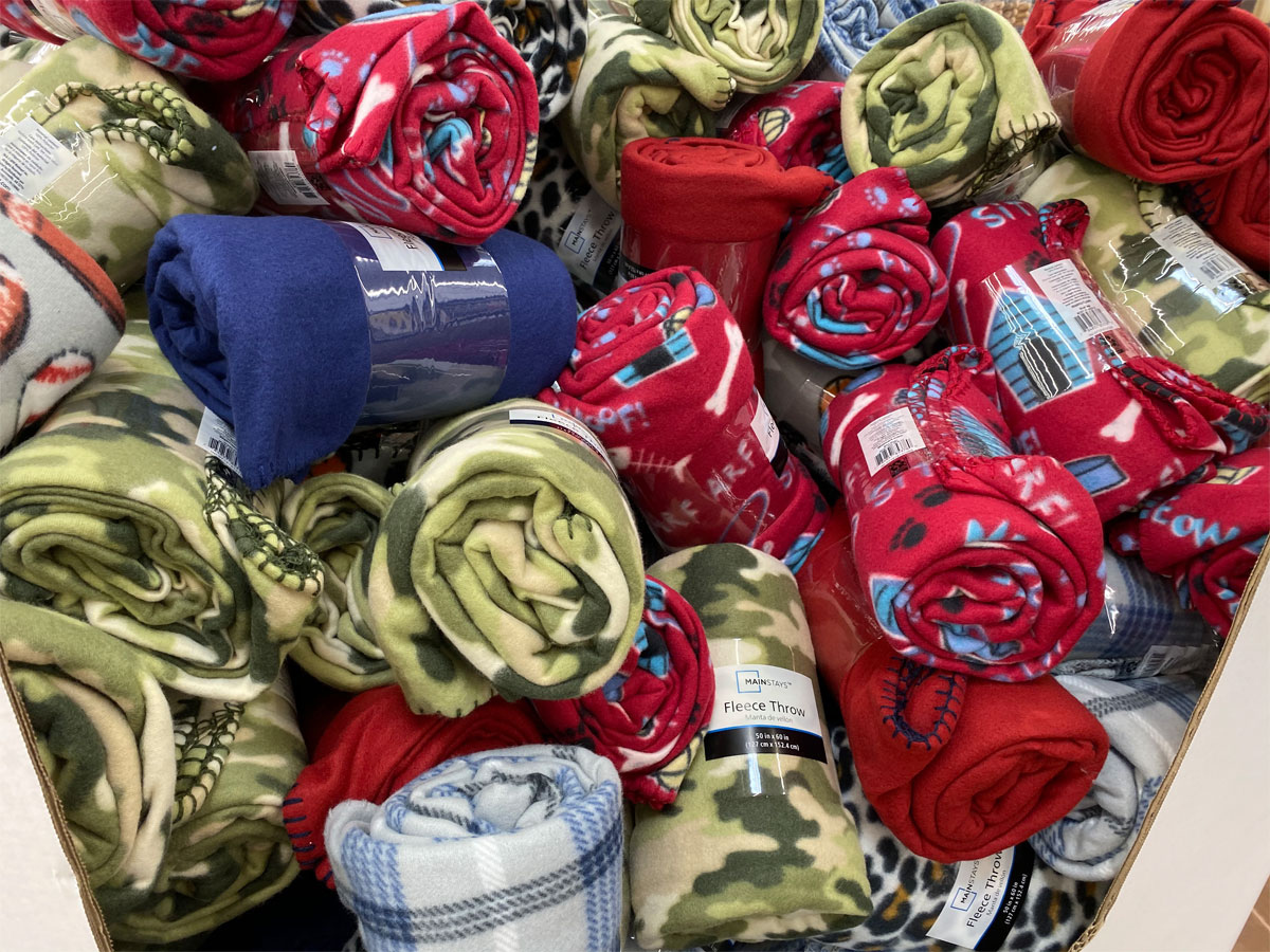 bin full of mainstays fleece throws at walmart for $2.50