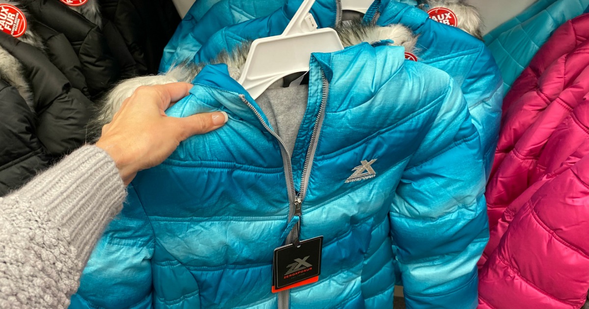 hand holding jacket in store