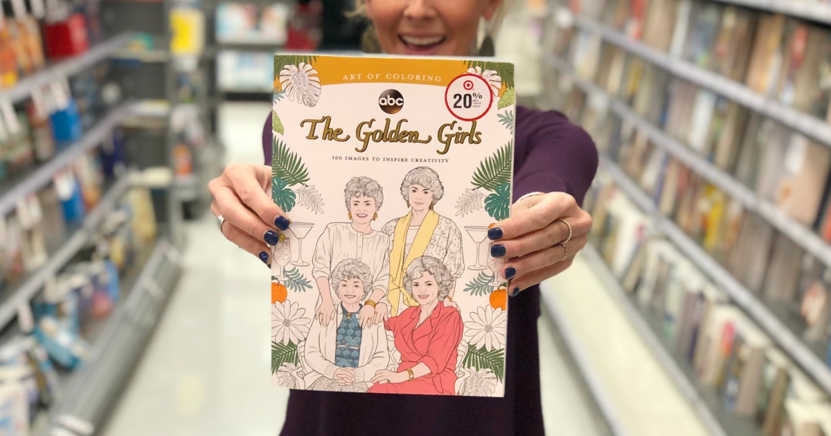woman holding golden girls coloring book