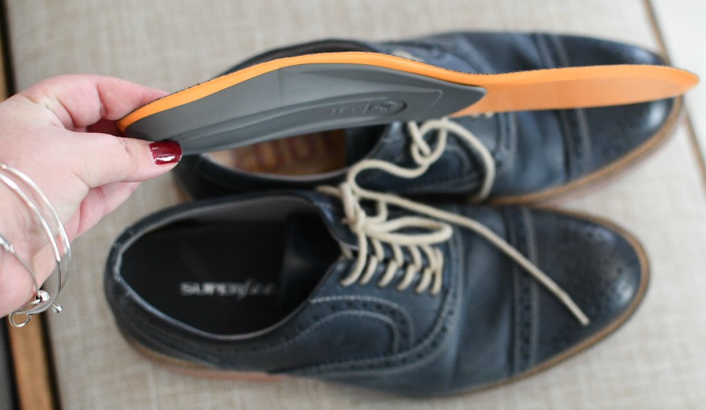 hand-holding-superfeet-shoe-insole