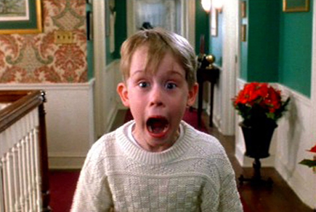 boy standing in hallway with mouth open