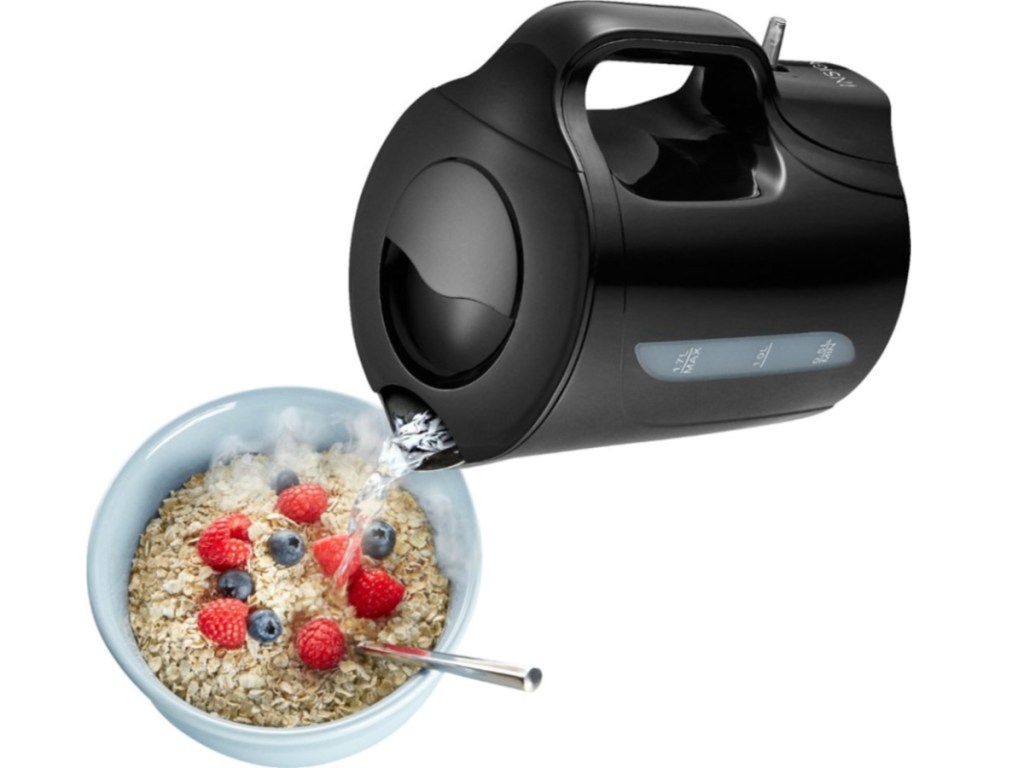 kettle pouring water into bowl of oatmeal