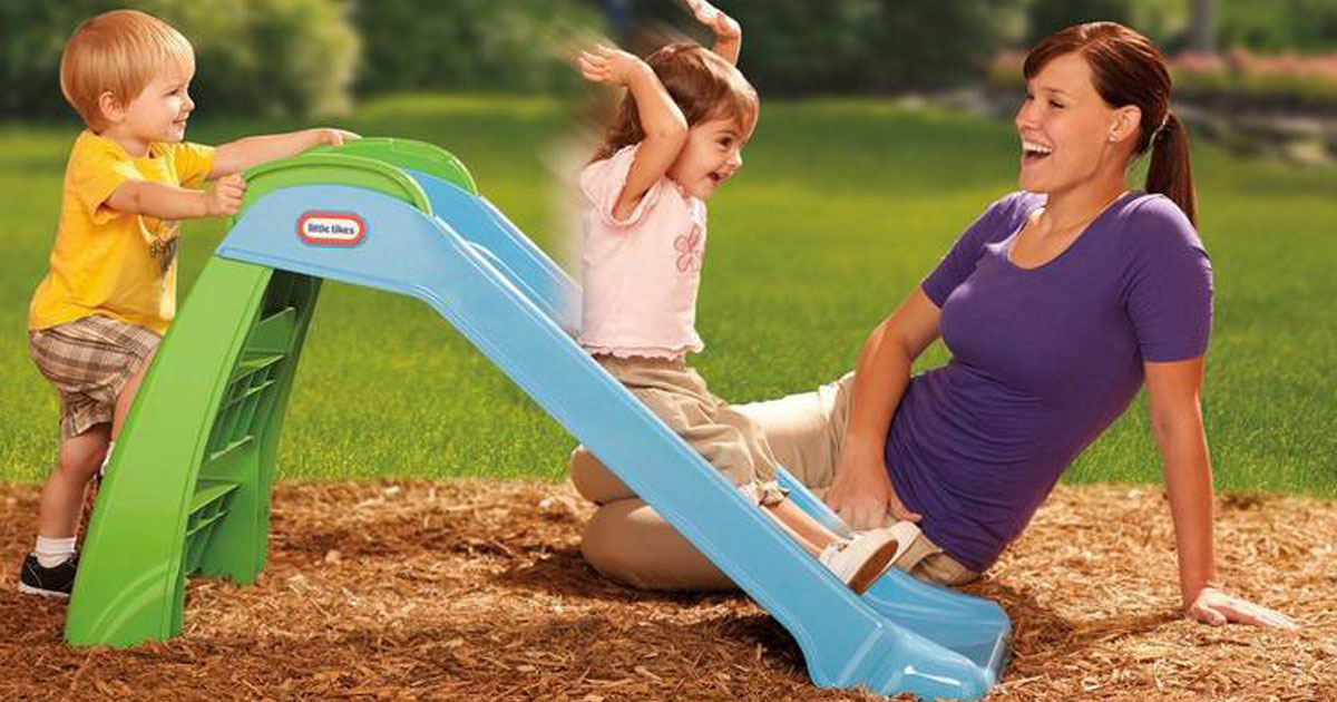 Mom playing with her kids on a Little Tikes First Slide at a playground