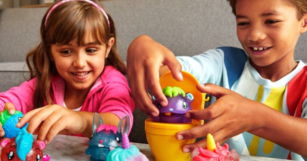 2 kids playing with Pooparoos toys