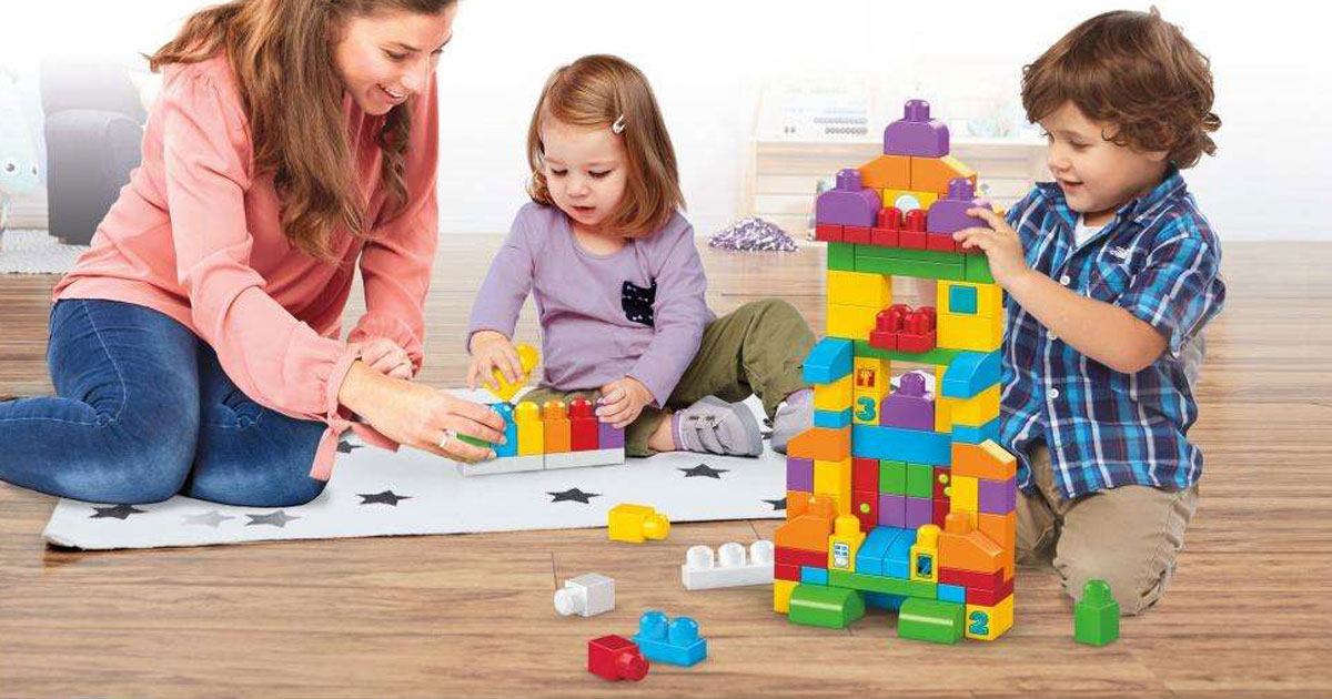 woman playing lego bricks with children