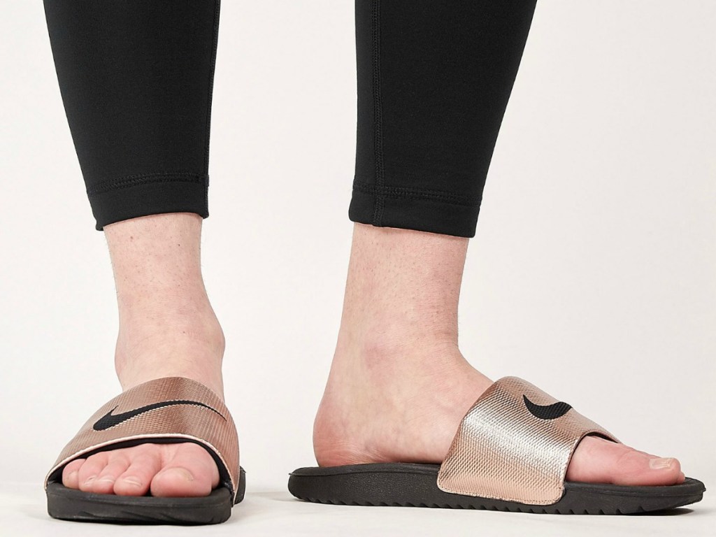 woman wearing sandals with black leggings