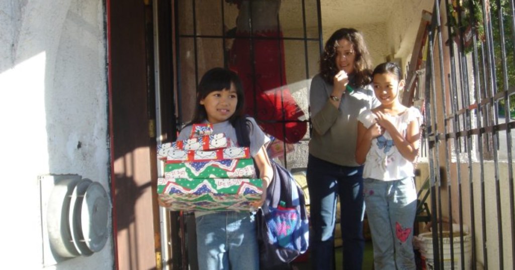 family receiving gifts from USPS Operation Santa