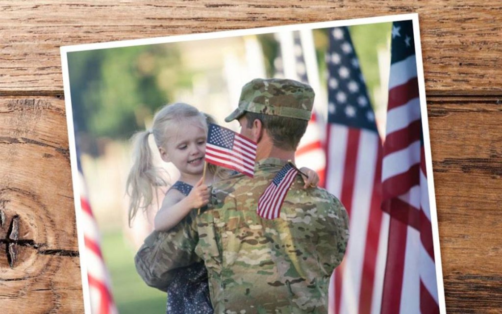 Photo of girl hugging military member