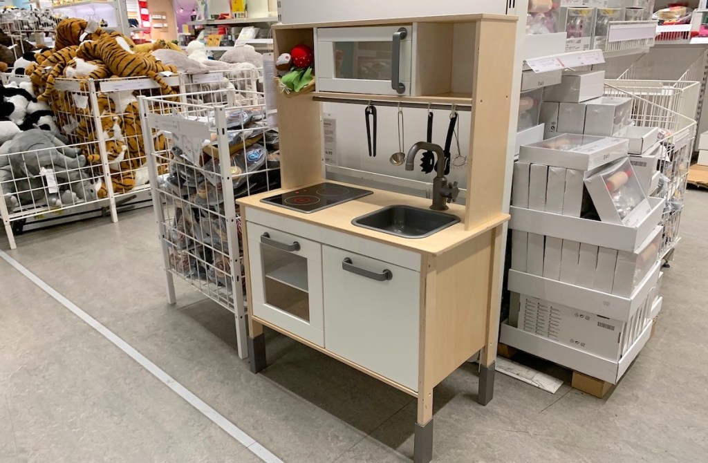 wood white ikea play kitchen in store with toys