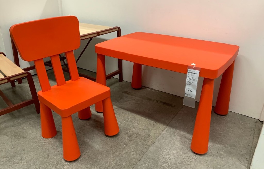 red plastic chair and table at IKEA store