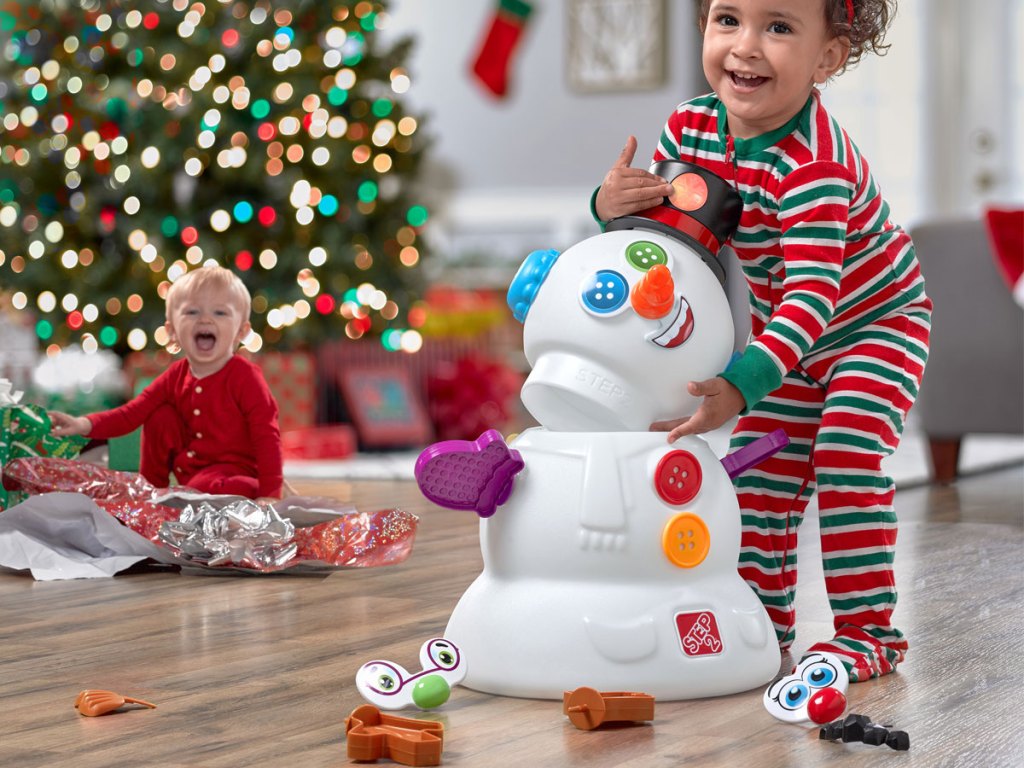 toddler playing with Step2 My First Snowman
