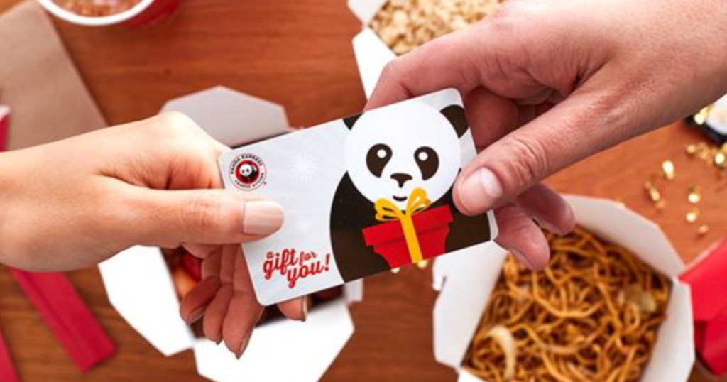 Hands holding Panda Express gift cards