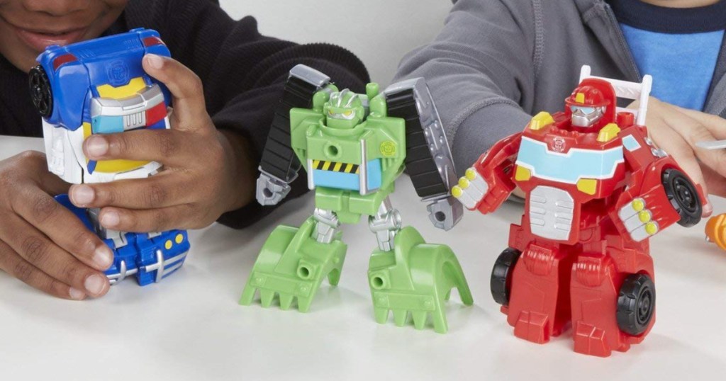 Kids playing with Playskool Transformers Rescue Bots