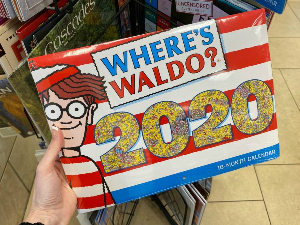 Hand holding a 2020 Wheres Waldo 16-Month Wall Calendar in store