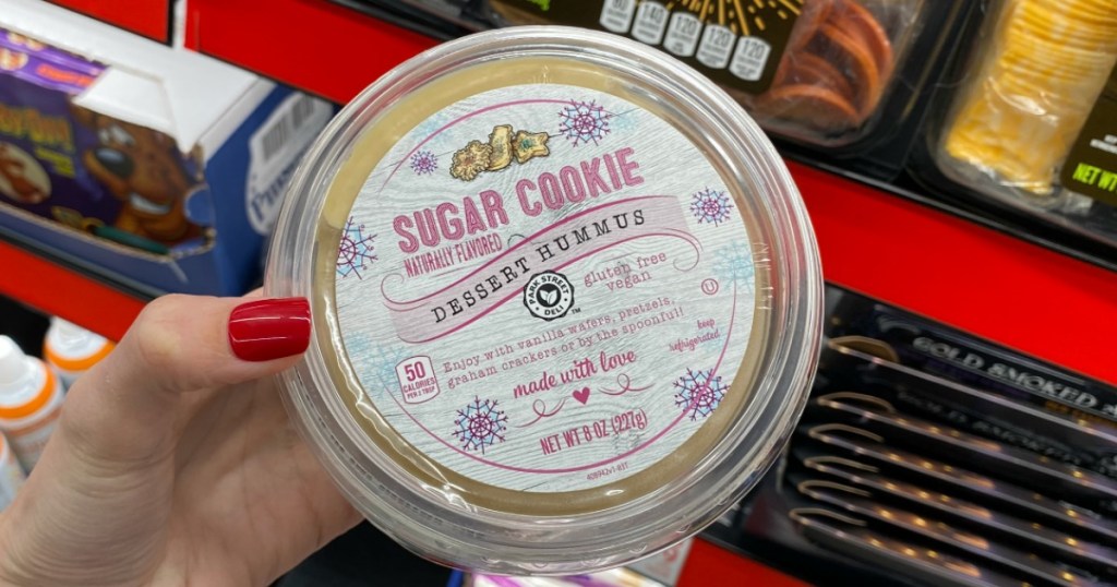 hand holding container of ALDI Sugar Cookie Dessert Hummus 