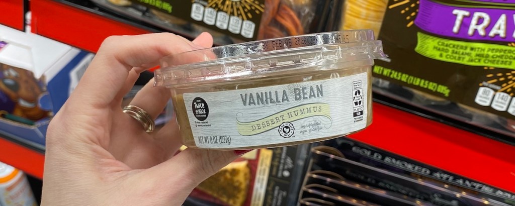 hand holding ALDI Vanilla Bean Dessert Hummus