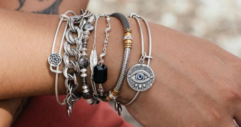 Alex and Ani Charm Bracelets on a ladies arm