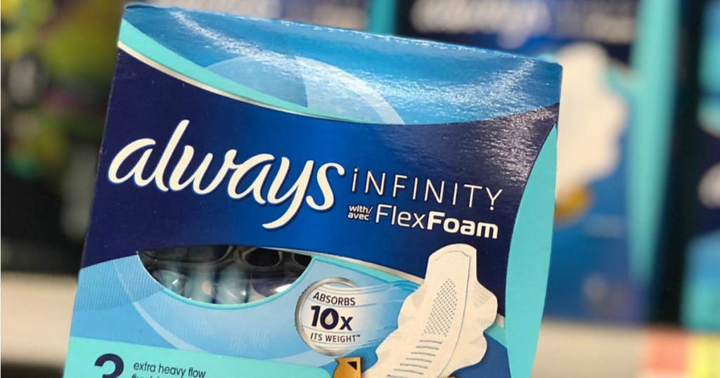 Woman holding up Always Infinity Flex Pads