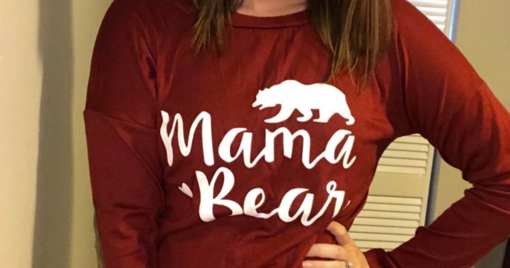 Woman wearing a Mama Bear printed women's tee in wine red